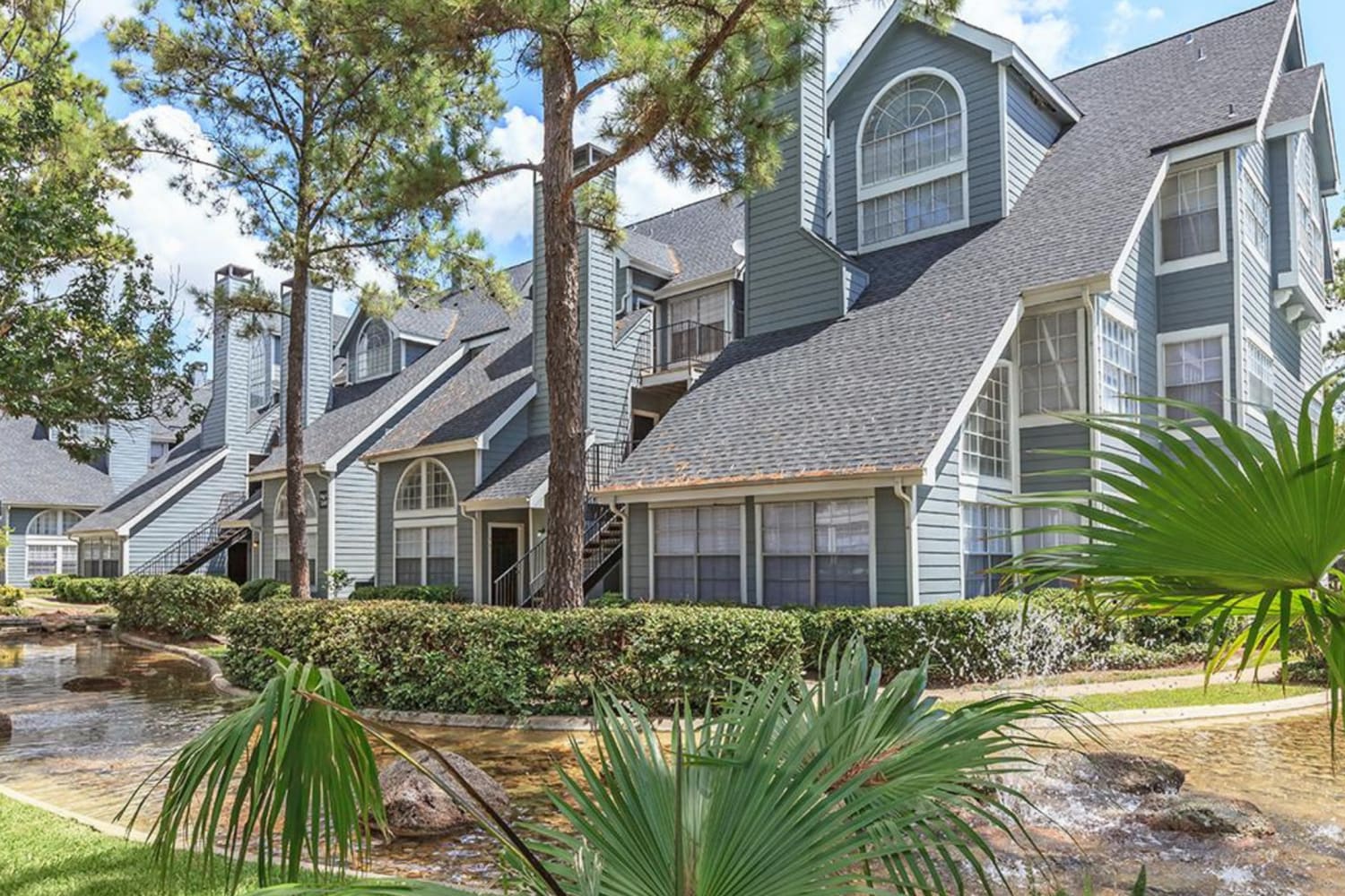 Exterior view of the apartment building at Pine Lake Village in Houston, Texas