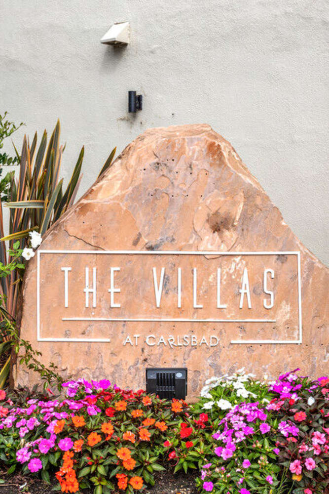 Future resident looking at photos of Villas at Carlsbad in Carlsbad, California