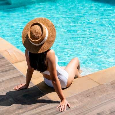 Resident by pool at Bella Vista Apartments in Santa Clara, California 