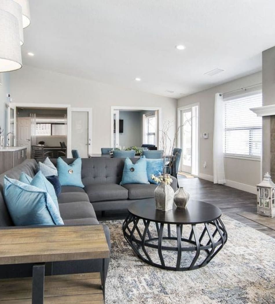 Cozy living room with a nice large sectional couch to relax on at Sofi Belmar in Lakewood, Colorado