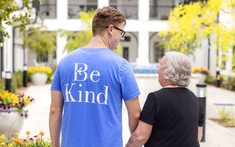 Resident being helped by a nurse at The Barclay at ParkSquare in Aventura, Florida