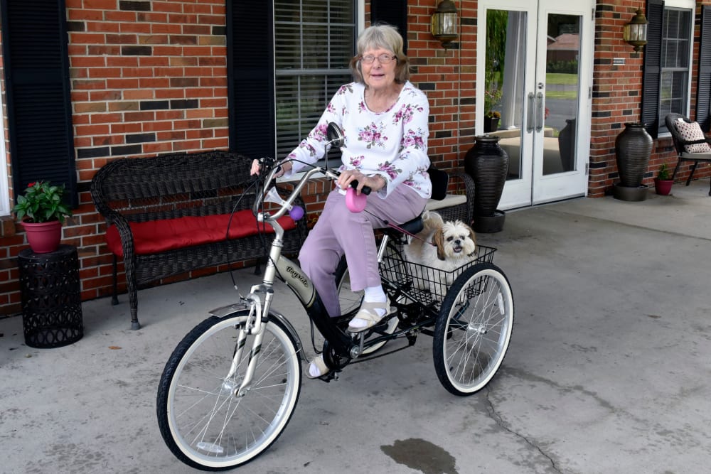 Resident biking outside Garden Place Millstadt in Millstadt, Illinois