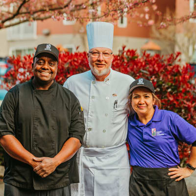 Chef and his crew posing for a photo at 6th Ave Senior Living in Tacoma, Washington