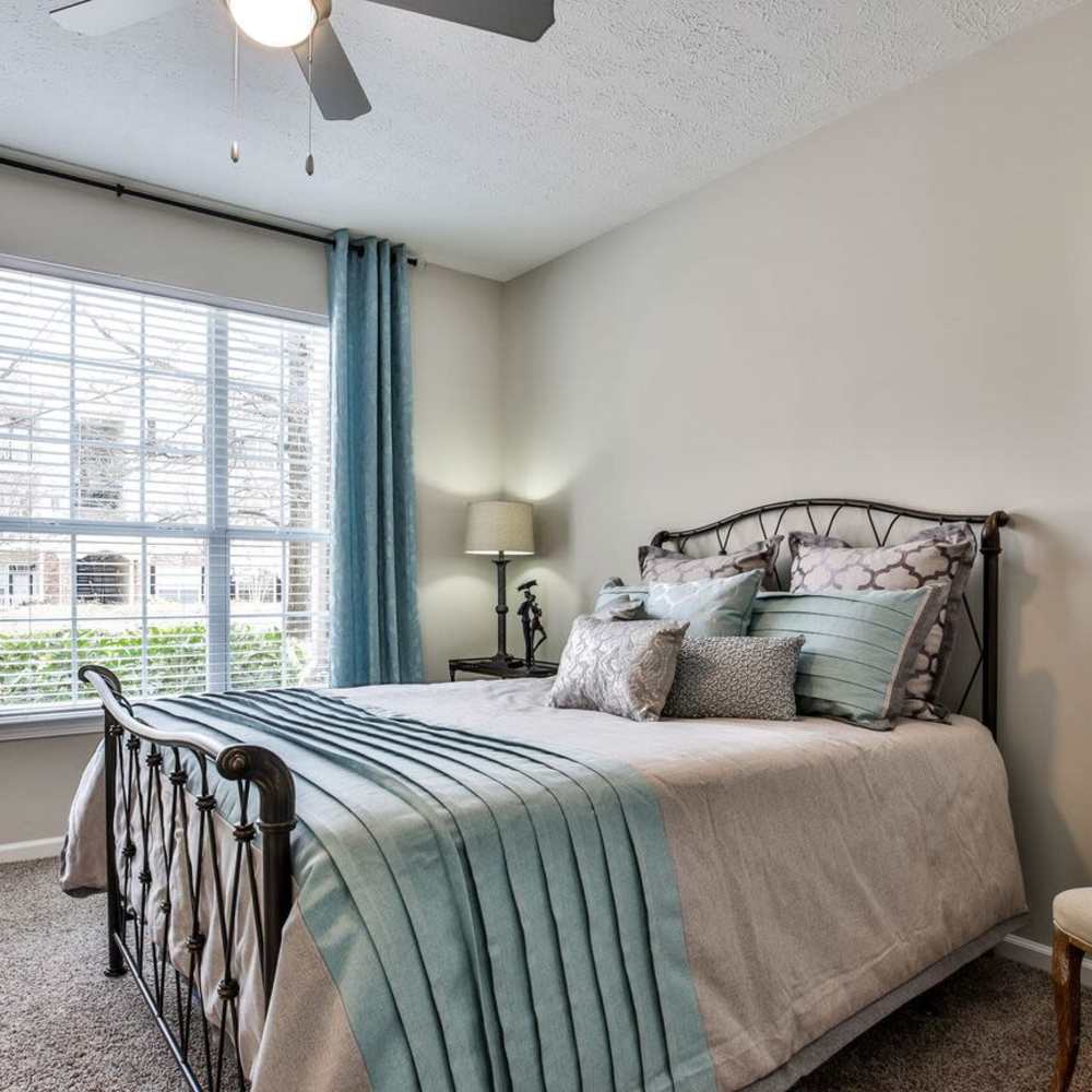 Model bedroom with blue accents Avonlea Highlands in Cartersville, Georgia
