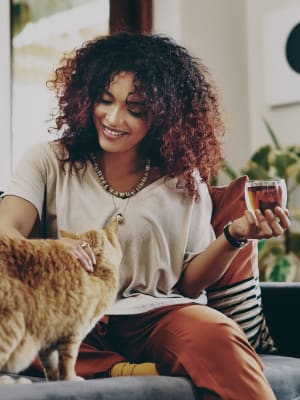 Resident spending time with her cat in their high-end pet-friendly home at The BLVD in San Angelo, Texas