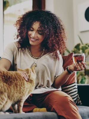 Resident spending time with her cat in their high-end pet-friendly home at Argon in Oklahoma City, Oklahoma