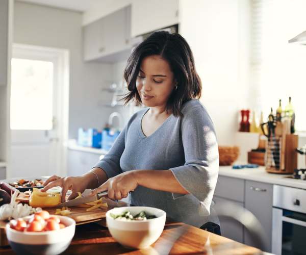 Resident cooking at home at Targa Real Estate Services, Inc. in Federal Way, Washington