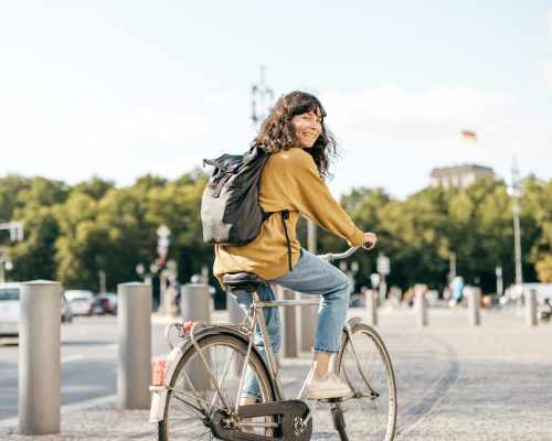 Woman cycling in the city near La Belle at Hollywood Tower in Los Angeles, California