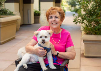 Resident and pet at senior living in Oceanside