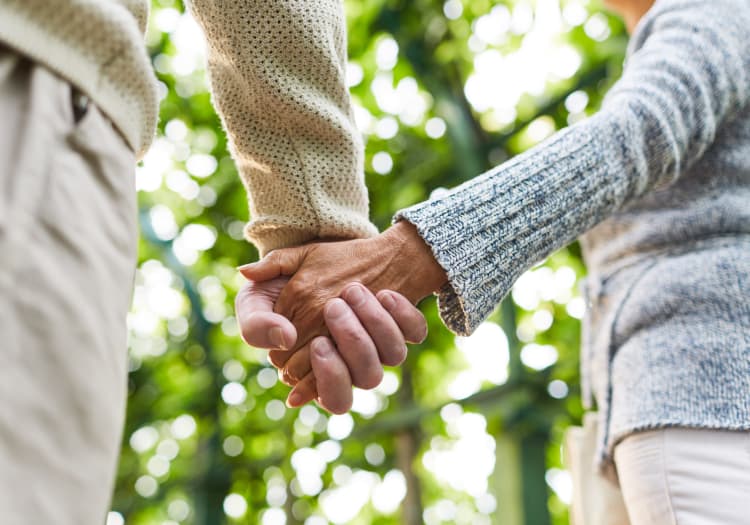 Senior couple holding hands at The Charleston at Cedar Hills in Cedar Hills, Utah