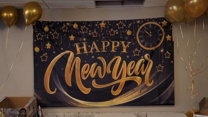 A Happy New Years sign hanging in our community.
