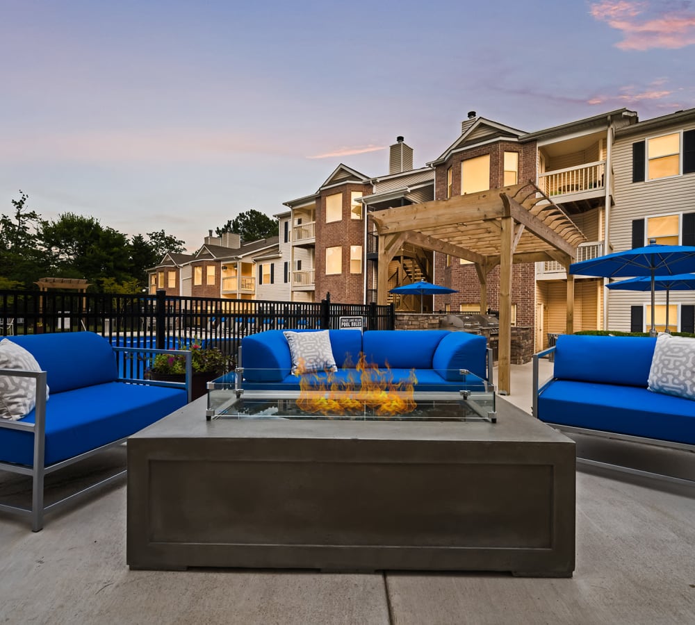Outdoor seating around a firepit at Chace Lake Villas in Birmingham, Alabama