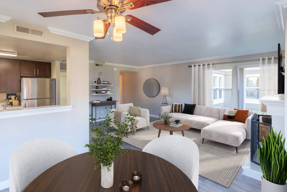 Spacious living room with lots of windows for natural lighting at Seventeen Mile Drive Village Apartment Homes in Pacific Grove, California