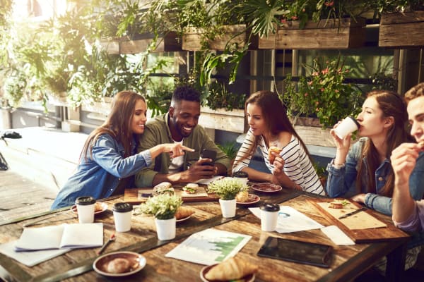 Residents meeting around a table to study near Parkside Towns in Richardson, Texas