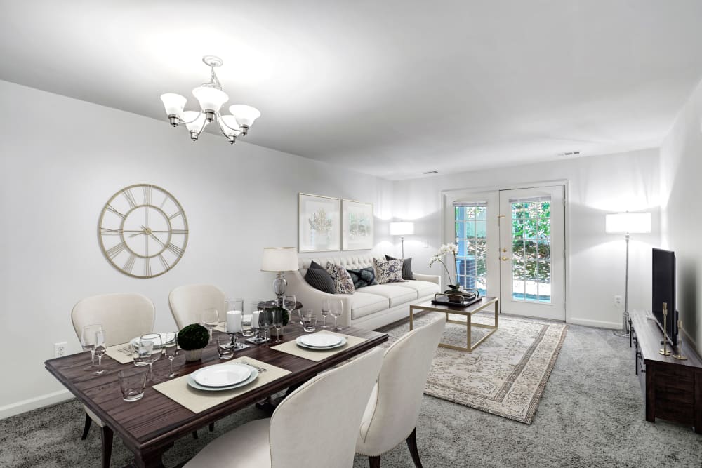 Spacious and modern living room with backyard access located at Horizons at Franklin Lakes Apartment Homes in Franklin Lakes, New Jersey