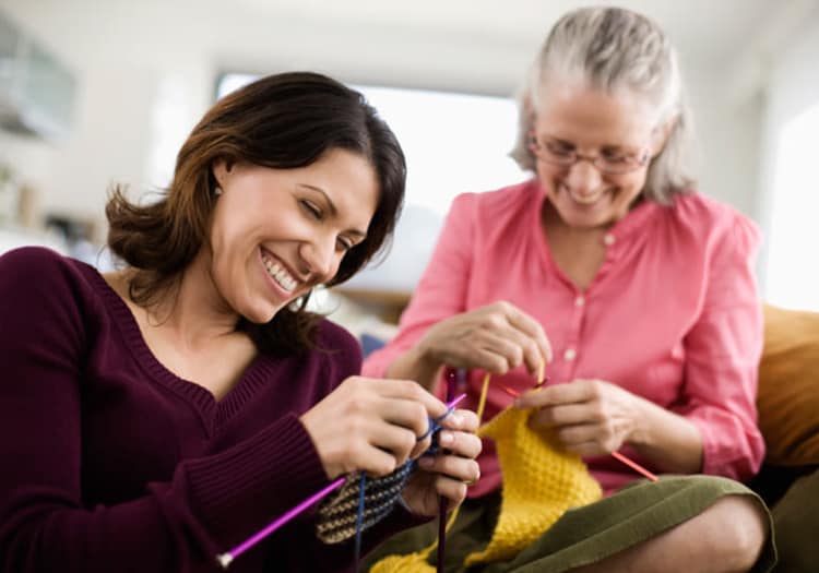 Senior making clothing at The Wellington in Salt Lake City, Utah