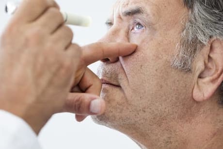 elderly-man-examined-by-an-ophthalmologist-aging-eyes-concept