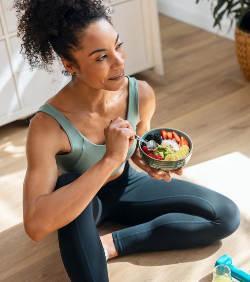 Resident having meal after workout at Milwee Street Apartments in Houston, Texas