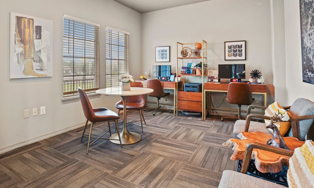 Computer area with chairs at The Remington Apartments in Wichita, Kansas