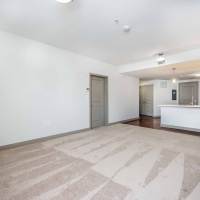 Unfurnished living space with carpet flooring at Mount Hope Lofts in Rochester, New York