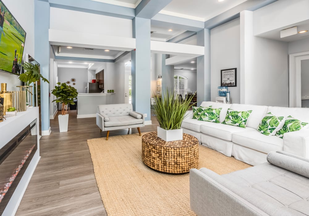 Well-decorated open-concept living space in a model home at Eddison at Deerwood Park in Jacksonville, Florida