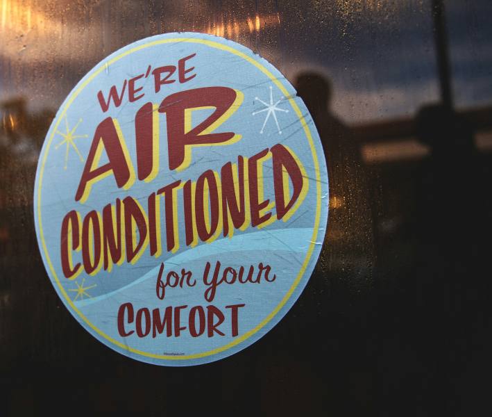 a sticker that says "we're air conditioned for your comfort"