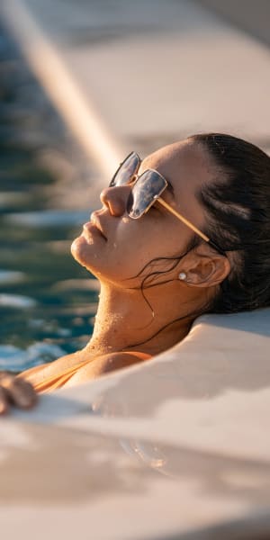 Resident enjoying the luxurious pool at The Residences at Waterstone in Pikesville, Maryland