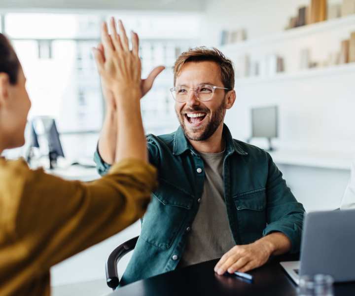Employees high fiving near Heather Hill Apartments in Temple Hills, Maryland