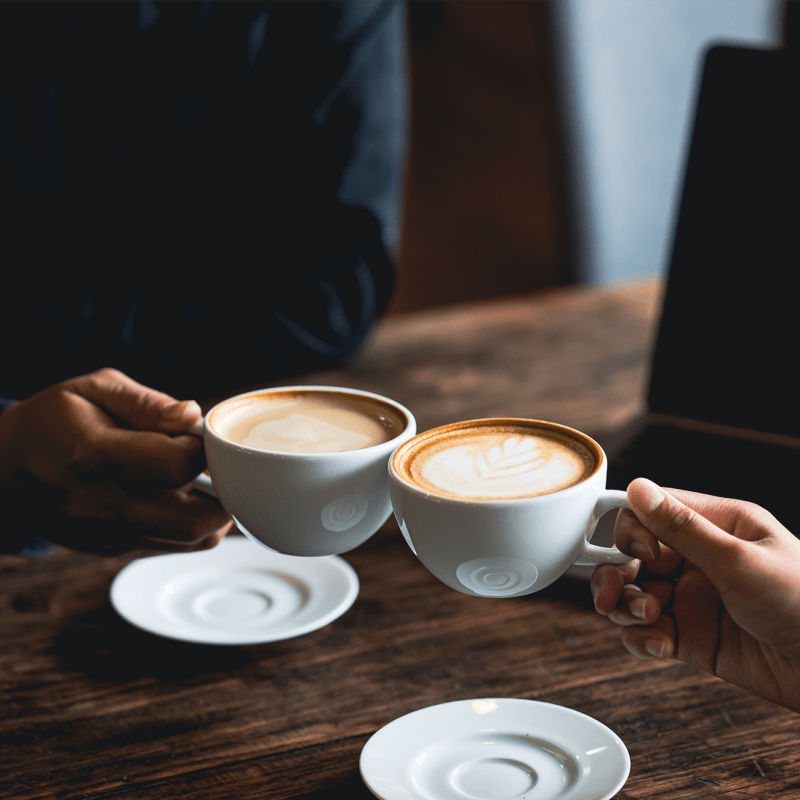 Residents holding coffee cups at Goldelm at Bennett Park in Bradenton, Florida