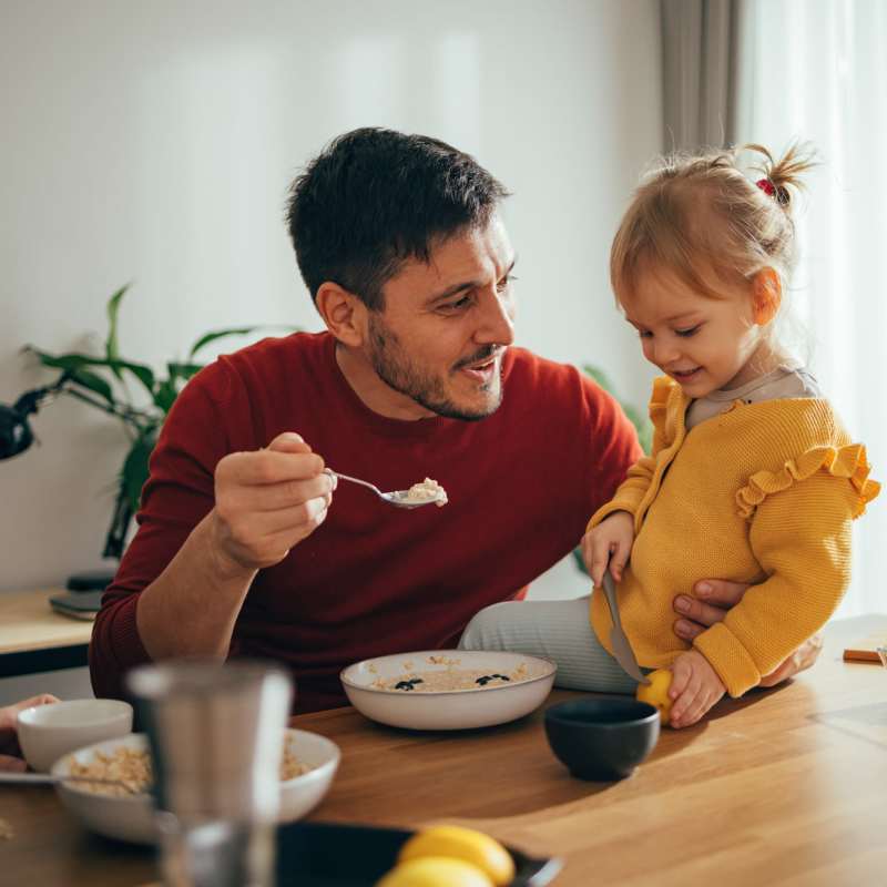 Resident and his daughter in his apartment at Alcove at Alamo Heights in San Antonio, Texas
