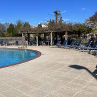 Swimming pool with lounge seating at Verandas at Mitylene in Montgomery, Alabama,