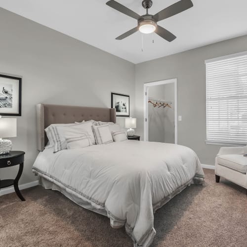 A bedroom with a ceiling fan at Grandewood Pointe in Orlando, Florida