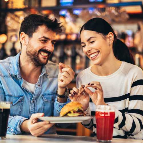 Couple having food at Park Hacienda Apartments in Pleasanton, California