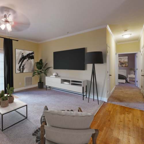 Living room with wood-style flooring at Sage Creek Apartments in Augusta, Georgia