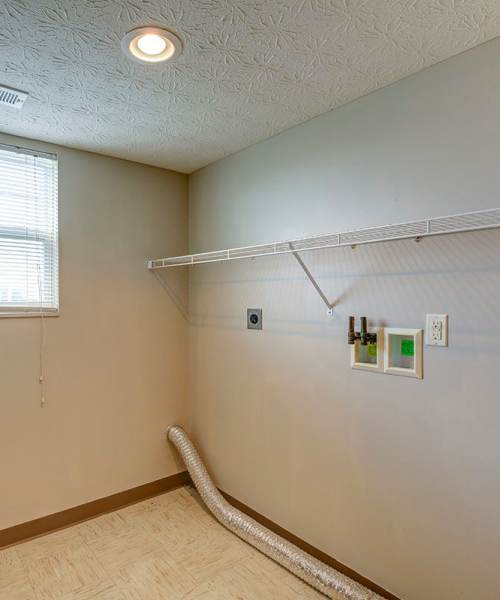 Wire shelf with wall-mounted hooks at Orchard Glen in Orrville, Ohio