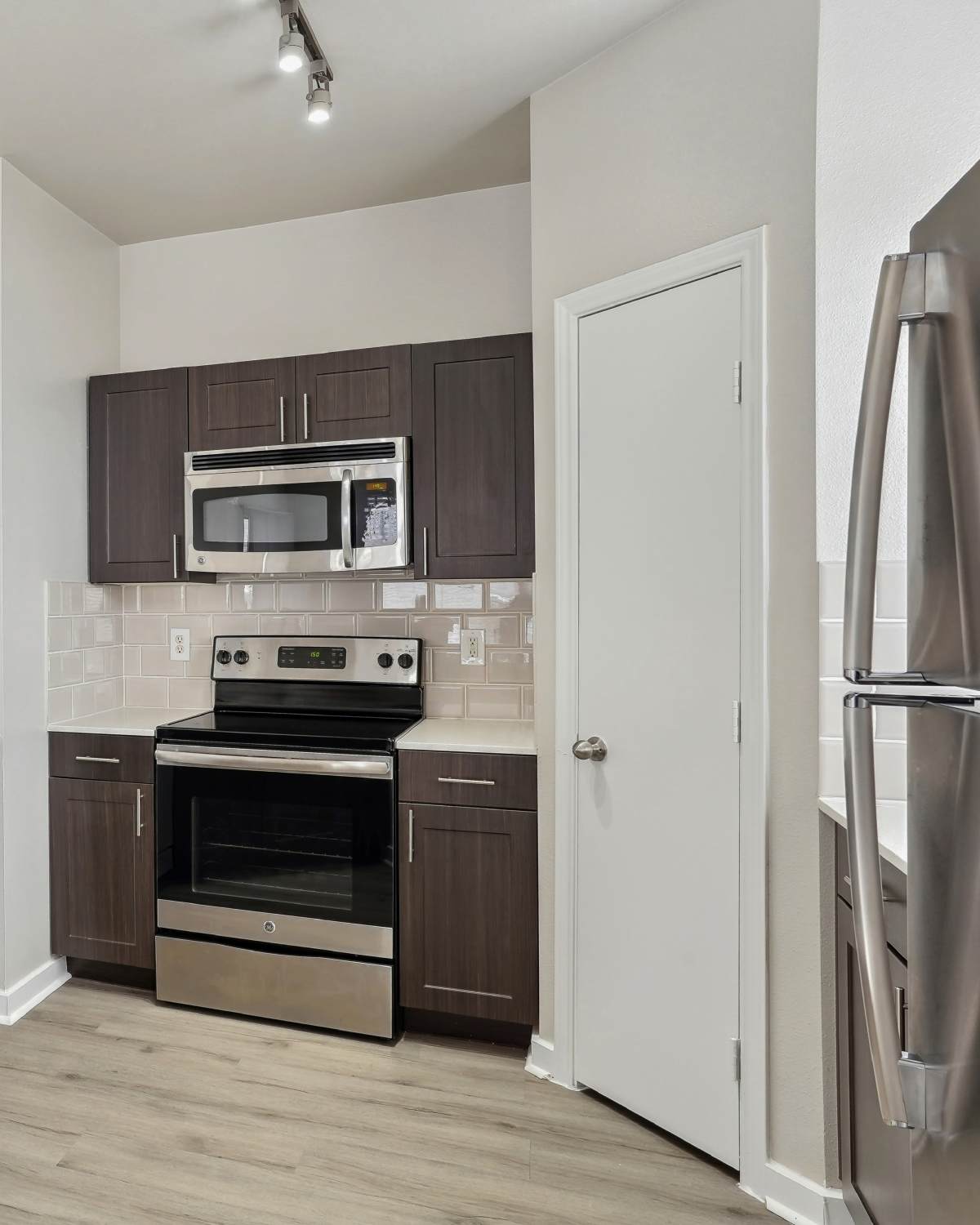 A community kitchen at Andover Park at Flatiron District at Austin Ranch in The Colony, Texas