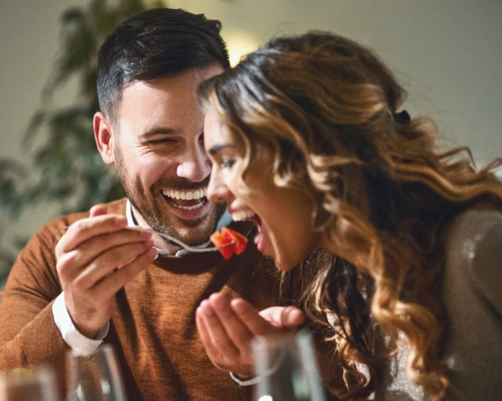 A happy couple eating at Osprey Point in Virginia Beach, Virginia