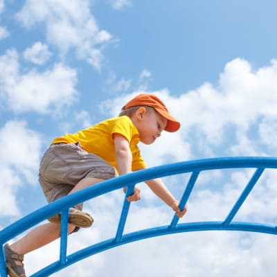 a boy on a playground at Shadow Mountain in Twentynine Palms, California