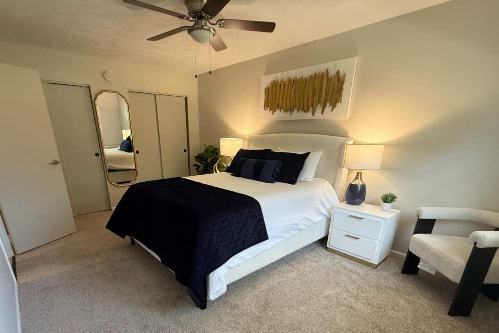 Staged bedroom with carpeting at Presidential Arms Apartment Homes in Allison Park, Pennsylvania