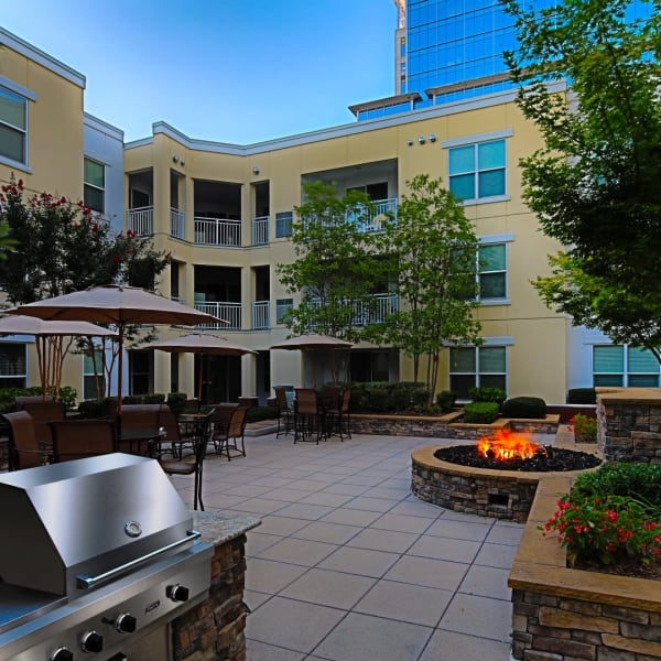 Garden-style courtyard with firepit and grill at Monticello Station, Norfolk, Virginia