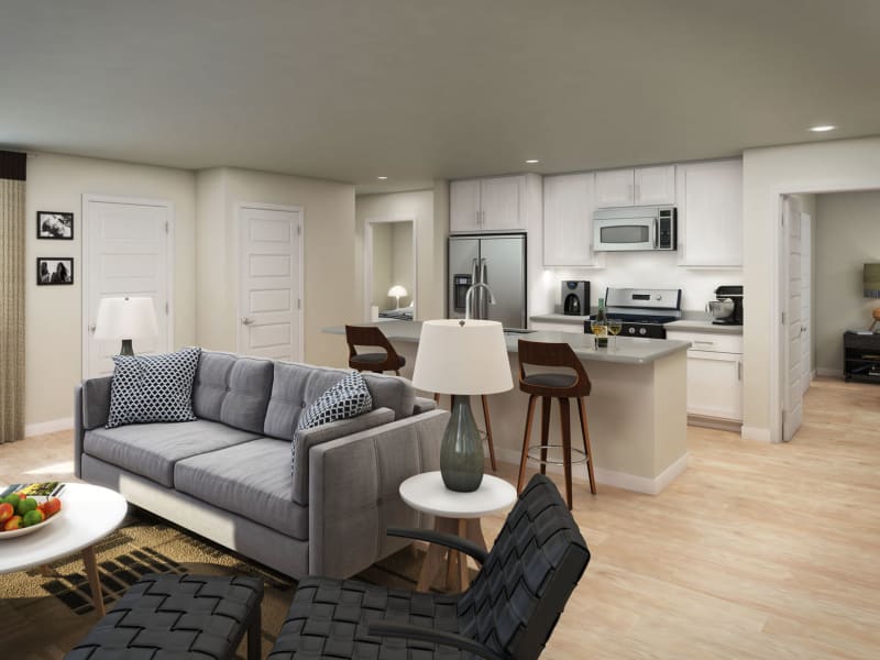 Well-furnished living area with hardwood flooring throughout in a model home interior rendering at Peralta Vista in Mesa, Arizona