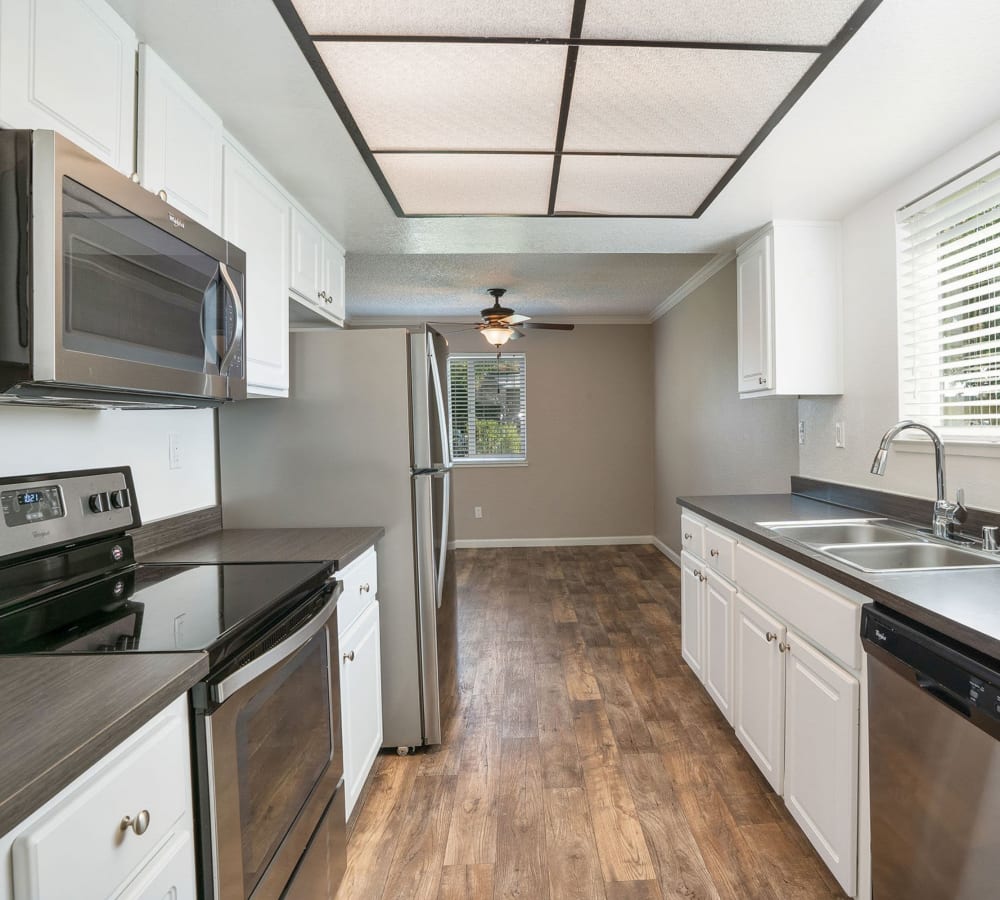 Beautiful kitchen with wood-style flooring at Ridgecrest Apartment Homes in Martinez, California