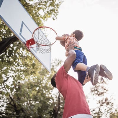 A father and his son playing basketball at Sampson Road in Dahlgren, Virginia