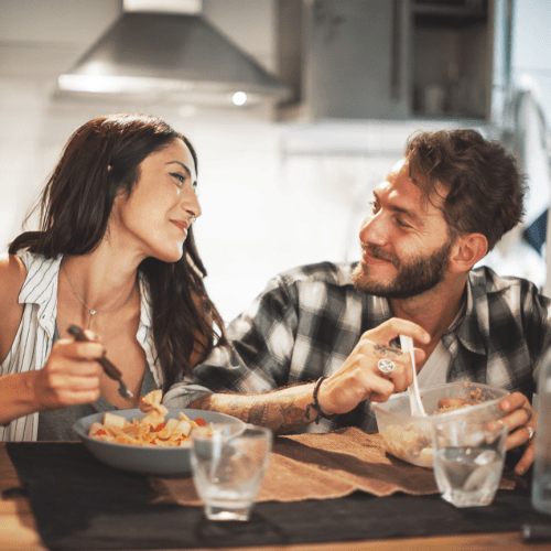 Couple sharing a meal at The Wright Apartments in Centennial, Colorado