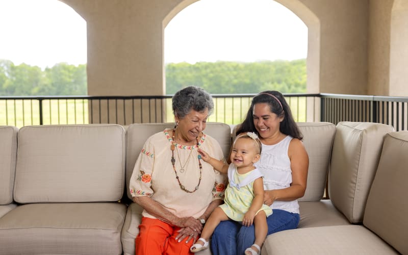 Resident hugging her granddaughter at a QSL Management community