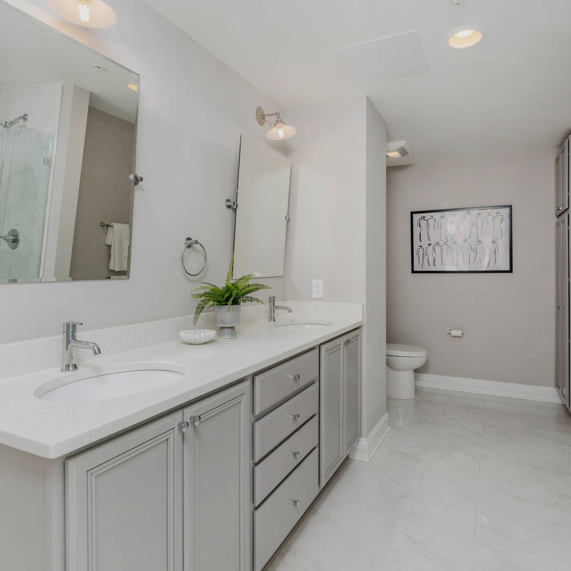 Modern bathroom with dual sinks and stylish fixtures at LeVeque Tower in Columbus, Ohio