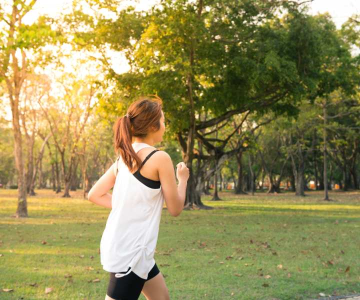 Resident jogging in the green park near Cypress in McKinney, Texas