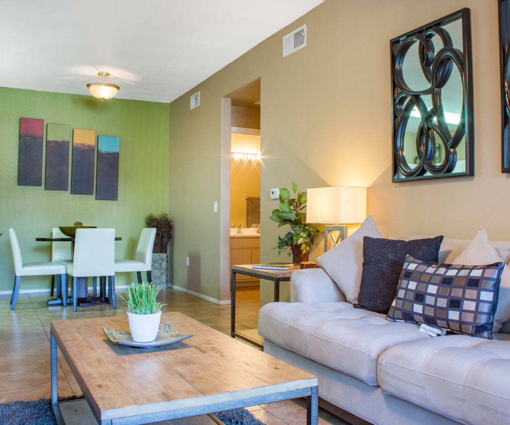 View of dining area from model home's living room in open-concept floor plan at Sierra Canyon in Glendale, Arizona