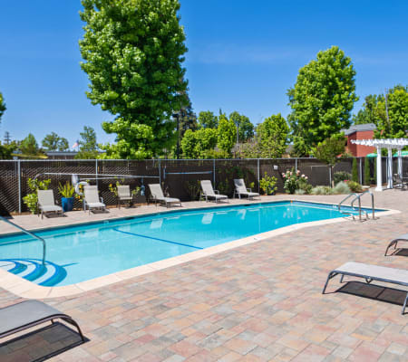 Outdoor community pool area at Parkway Apartment Homes in Fremont, California