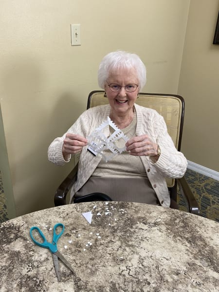 A Bradenton (FL) resident shows off her handmade snowflake!